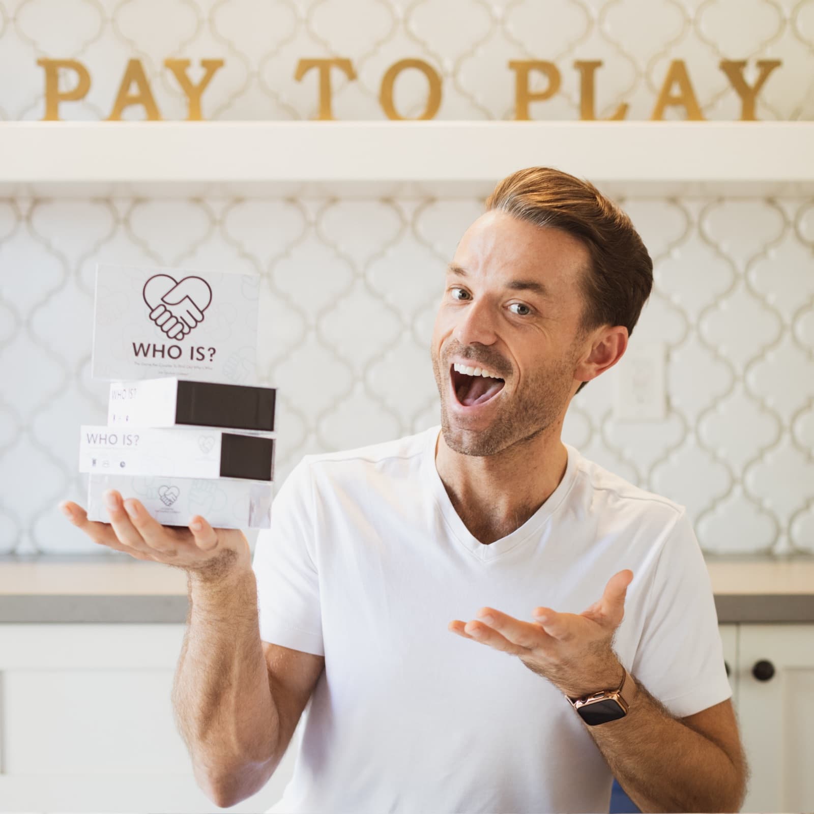 Patrick Frank, founder of The Couples Company, holding a WhoIs? box
